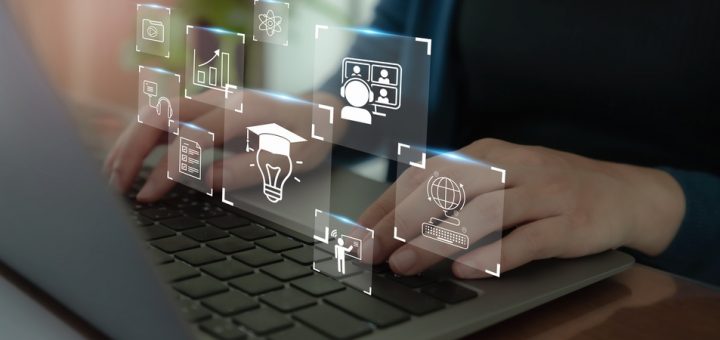 Icons depicting online education, tech, machine learning, data, and more, on top of a person's hands pressed on laptop keys.