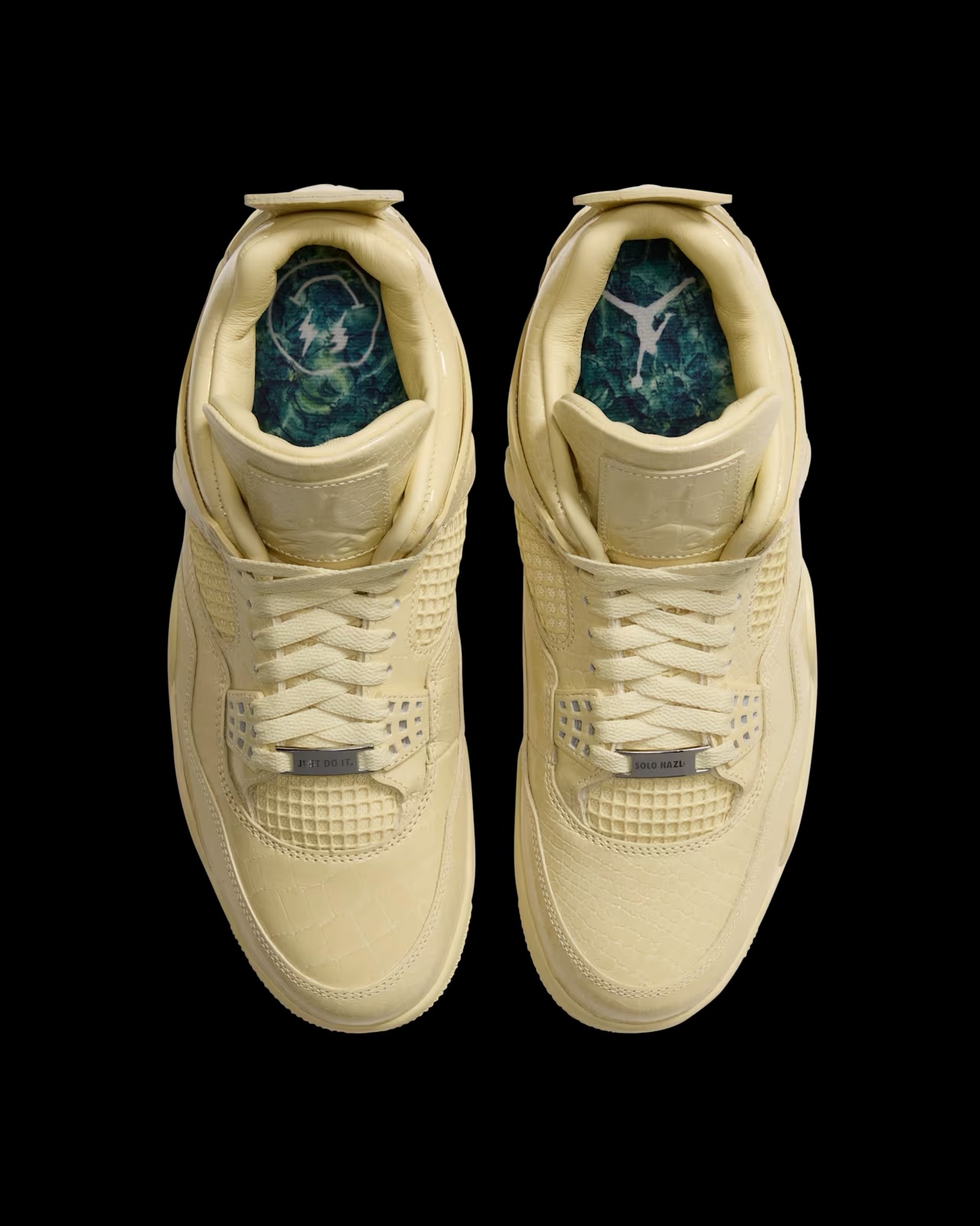 Top-down view of Air Jordan 4 x J Balvin sneaker pair revealing teal insole lining