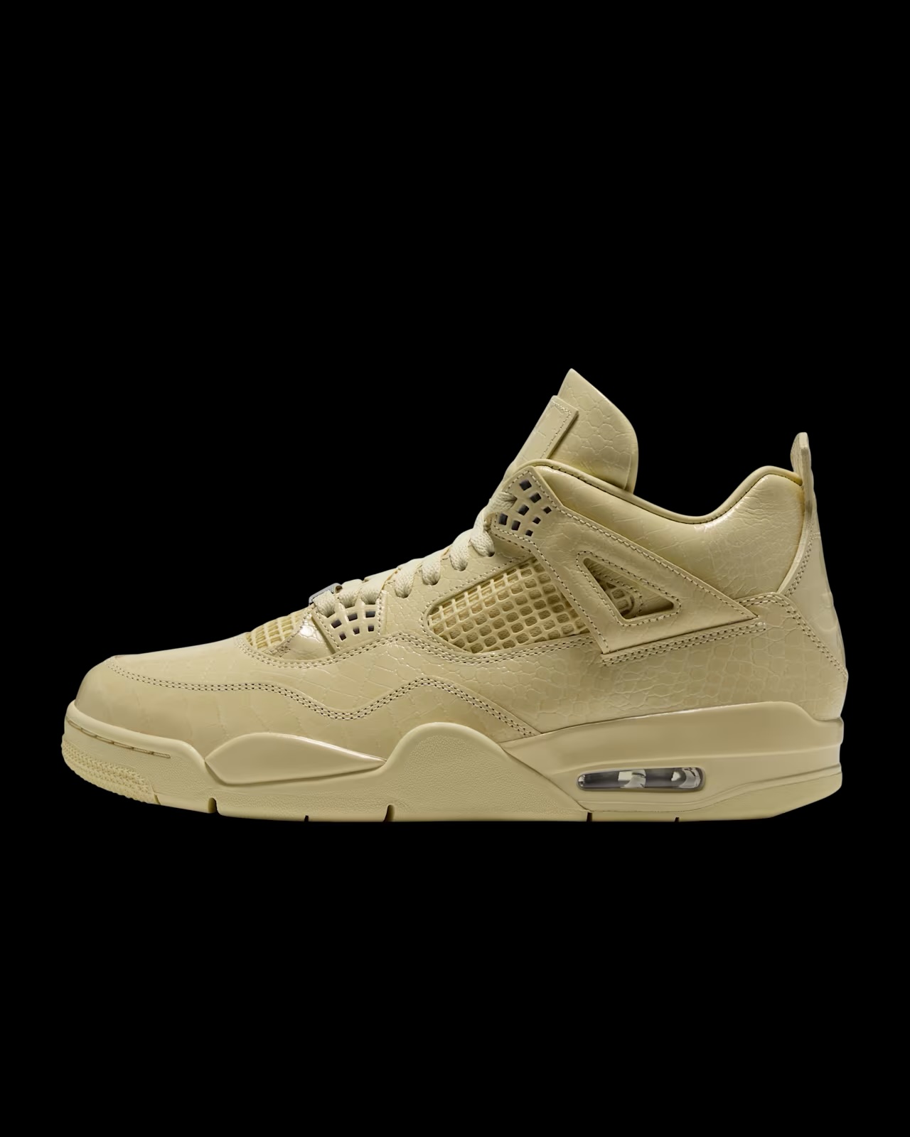 Air Jordan 4 x J Balvin sneaker in tan suede, lateral side view on black background