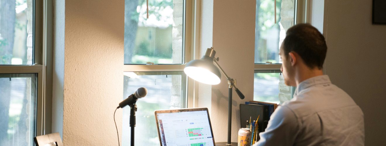 Freelancer working on a side hustle from a home office